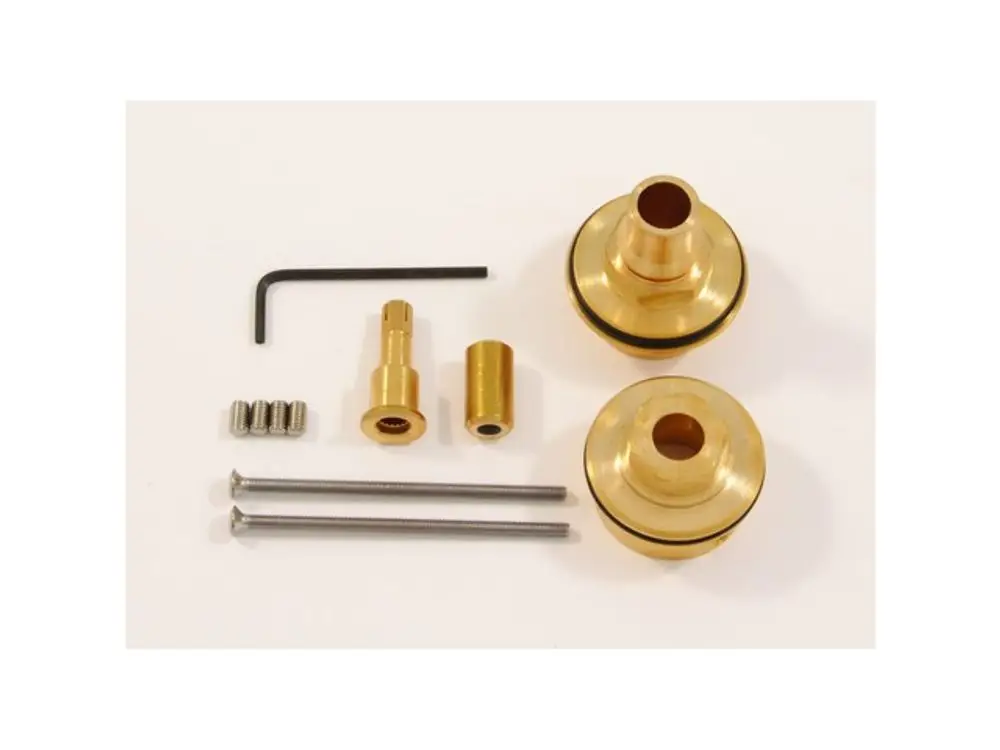 Verpackung mit Metallteilen, darunter zwei goldfarbene Bauteile, Schrauben und ein Inbus-Schlüssel. Ideal Standard Ersatzteile für Thermostate.